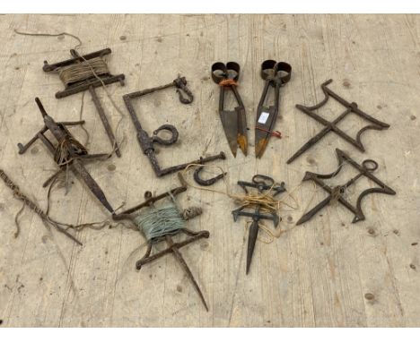 Two pairs of Vintage gardening shears, together with a group of wrought iron lawn lines.&nbsp;