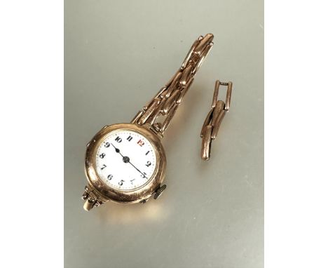 A ladys vintage 9ct gold wristwatch with white enamel dial and arabic numerals D x 2cm on expanding 9ct bracelet with extra l