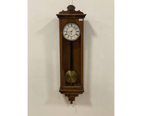 A late Victorian rosewood and mahogany cased Vienna type wall clock, having a white enamelled dial with Roman chapter ring, s