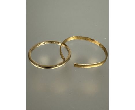 A 18ct gold wedding band M/N 1.5g and a yellow metal wedding band cut 1.1g (2)