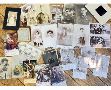 A quantity of antique and vintage photographs and postcards from Great Britain and America including a photograph of Paul Rob