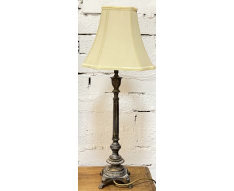 A substantial cast metal lamp with classical style base and plain shade (h- 77cm)