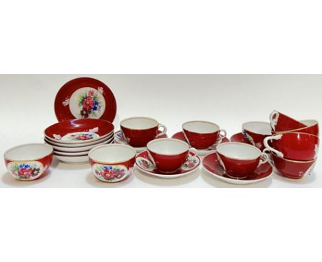 A Russian Gardner porcelain part tea and coffee set with rouge ground and hand painted rose and leaf panels comprising five t