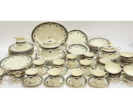 A Minton 'Grasmere' pattern tea and dinner service comprising ten soup bowls, a large oval ashet (w- 35cm), thirteen dinner p