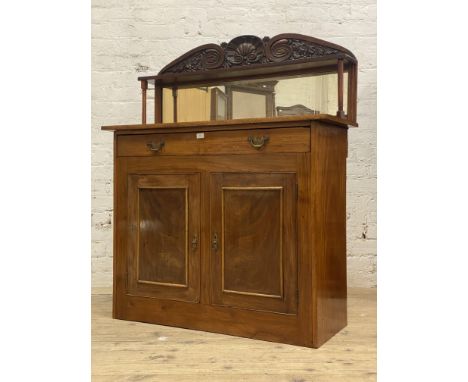 A mid 19th century mahogany chiffonier, the raised mirror back with open shelf supported by ring turned pilasters having a sc