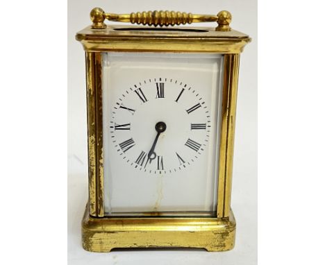 A lacquered brass carriage clock with enamelled dial and Roman numeral chapter ring (complete with key-winder)