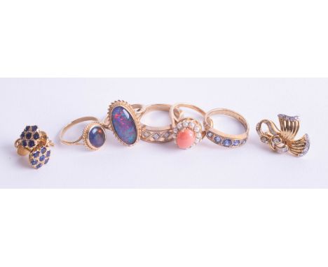 A 9ct opal set dress ring together with four other 9ct gold rings,(approximately 18.20g) a pair of fancy earrings marked 18k 