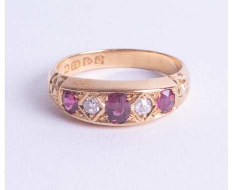 An antique 18ct ruby and diamond set ring, size O.