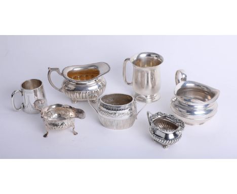 A small silver tankard, together with various silver cream jugs, sucre, and crystal mug (7) 29.98oz.