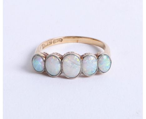 An 18ct five stone and opal set ring, size P.