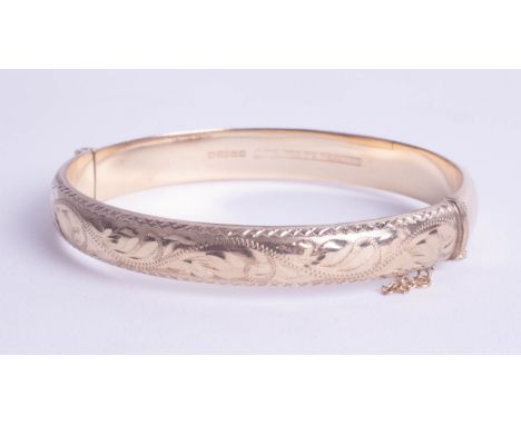 A 9ct gold bangle, approx 10.60g.