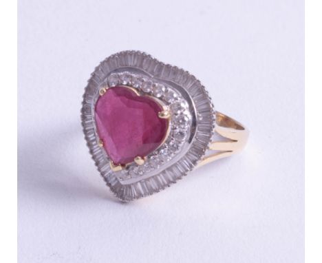 A stunning, large 18ct ruby and diamond set heart ring, size Q.