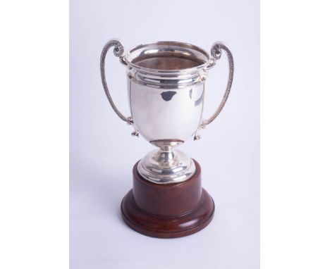 A Geo V silver twin handled trophy, height 20cm on wooden socle base, overall height 31cm.