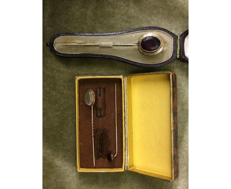 CASED UNMARKED CABOCHON STICK PIN , UNMARKED YELLOW METAL MOONSTONE STICK PIN AND ONE OTHER