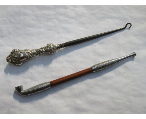 DECORATIVE SILVER COLOURED AND TURNED TREEN OPIUM PIPE AND SILVER HANDLED BUTTON HOOK.