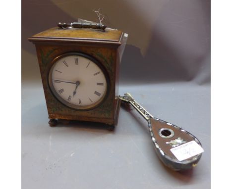 A walnut carriage clock, hand painted with flowers having Arabic numerals  on turned feet and a tortoiseshell miniature ornam