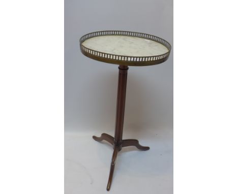 A marble top jardiniere stand having mahogany tripod legs 72cm in height, top measures 27cm x 36cm