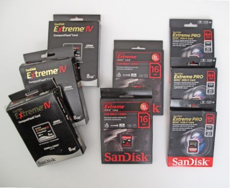 A collection of SanDisk memory cards comprising 2x16MB SDHC cards, 3x64MB SDXC Extreme PRO UHS-II cards and 3X8GB Compact Fla