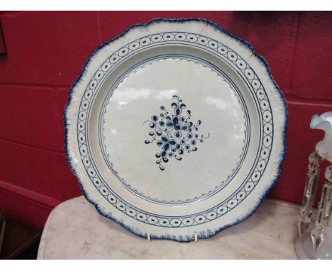 Two 18th Century blue and white chargers in the Worcester style, hairlines to both, 39cm diameter