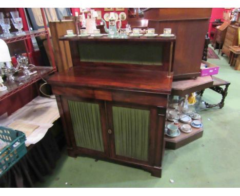 A circa 1800 mahogany chiffonier the three quarter pierced brass gallery and raised shelf on reeded brass supports over two f