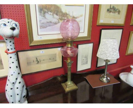 A Victorian pink oil lamp and shade, with globular shade, 77cm tall   