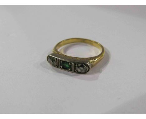 An Art Deco ring, the central emerald flanked by old cut diamond each side. Size J/K