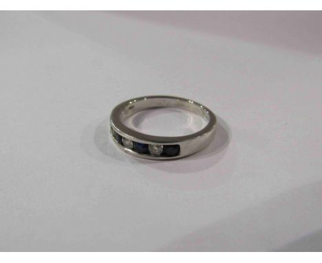 A 14ct sapphire and diamond half eternity ring. Size N/O