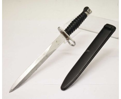 1957 model Swiss Army military bayonet, black twist grip with plastic scabbard, stamped 'W 474764' to 23cm long blade, 38cm l