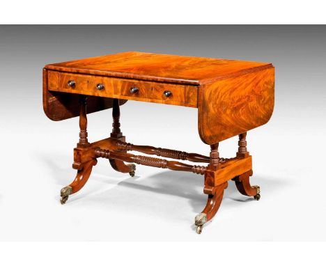 19th Century mahogany sofa table, the top with D-end drop flaps over pair of drawers with ebony ring-turned handles and oppos