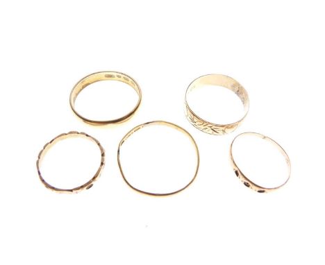 Two 18ct gold rings, (hallmarks worn), signet ring stamped '9ct' (cut), band stamped '10k', and two unmarked yellow metal ban