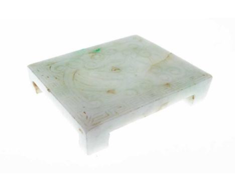 Chinese carved celadon jade miniature stand, on footed rectangular design with scroll and Greek key decoration, 53mm x 44mm