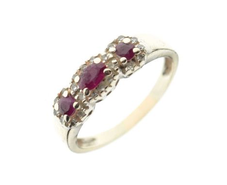 Unmarked white metal ruby three-stone dress ring, size R approx, 3.1g gross approx