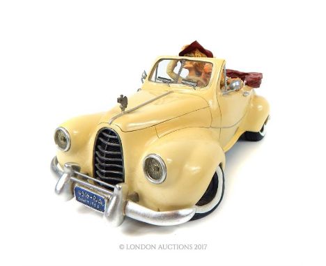 G. Forchino, (designed in France) detailed, hand-painted model of open-top vintage car with couple inside, 14 x 33 cm. 
