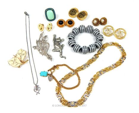 A large selection of designer costume jewellery to include a large 'Trifari' rhinestone floral spray brooch, a 'Hollywood' do