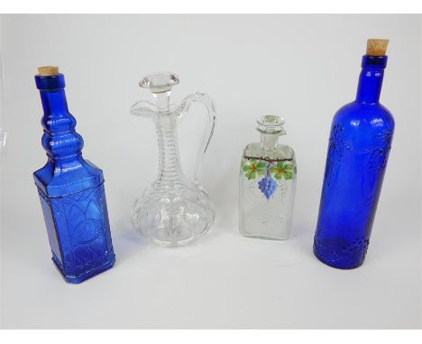 A cut glass decanter having a scrolling handle, 28 x 14 x 14cm, together with another glass decanter with hand painted vine d