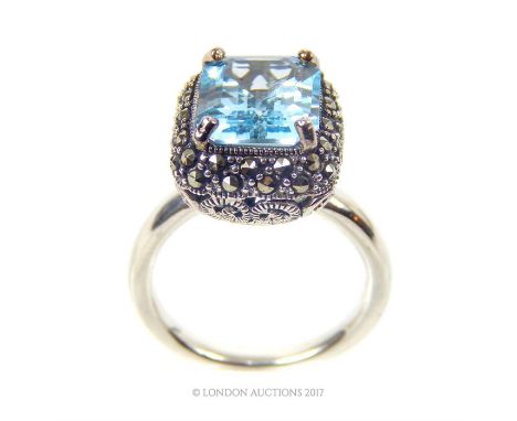 A large silver and aquamarine ring; size Q.