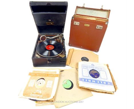 A Vintage, cased, wind-up record player by His Master's Voice sold with a quantity of records in a brown fitted carry-case an