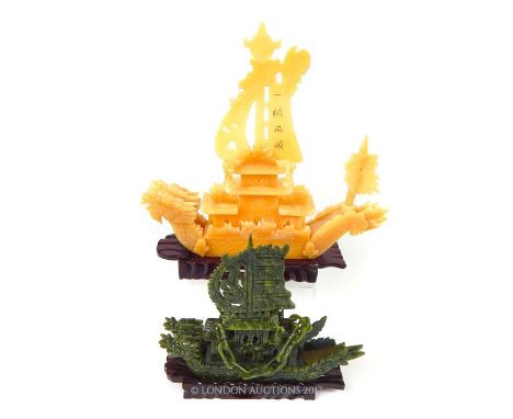 Two 1950's Chinese, hard-stone/jadeite carved galleons on hardwood stands, the larger model composed out of sections of yello