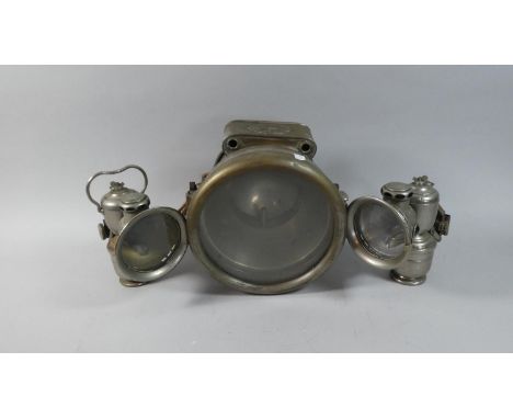 A Vintage Car Headlight by Howes &amp; Burley Ltd Together with a Pair of Carbide Bicycle Lamps 