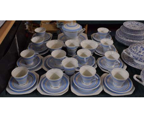 A Palissy Art Deco Blue and White Tea Set to Comprise Twelve Trios, Teapot, Two Sugar Bowls, Cream Jug and Two Bread and Butt