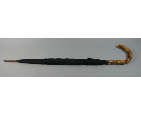 A Gold Mounted Vintage Umbrella 