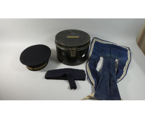 A Vintage Circular Hat Tin Containing a French Marine Nationale Hat, Beret etc 