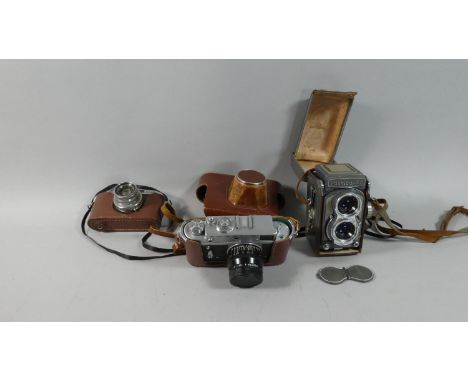 A Collection of Three Vintage Cameras to Include Yachica 44, Halina 35X and Leather Cased Zorki-4 