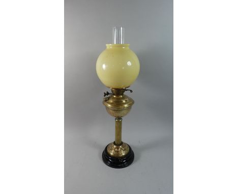 A Late Victorian Brass Oil Lamp with Opaque Glass Shade and Clear Glass Chimney, 65cm high 