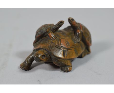 A Carved Wooden Netsuke in the Form of Three Tortoises, 5cm Wide 