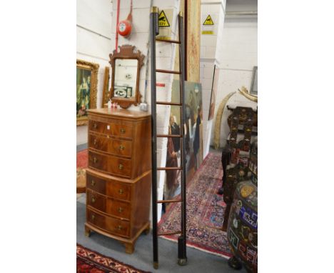 A brass studded leather upholstered mahogany folding pole/library ladder.