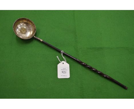 A coin inset silver toddy ladle.