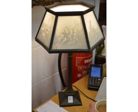 An unusual table lamp, the shade made with porcelain lithophane.