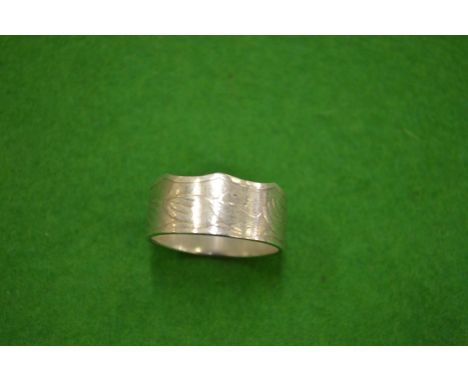 A Commonwealth 50p  piece coin ring size Y½.