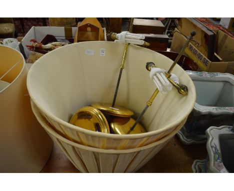 A pair of lamp shades and lamp mounts.